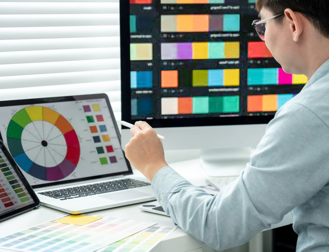 designer working with computer and creative tools