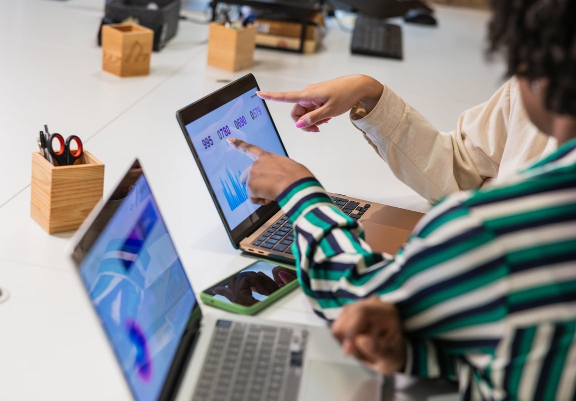 marketing team analyzing customer data laptop
