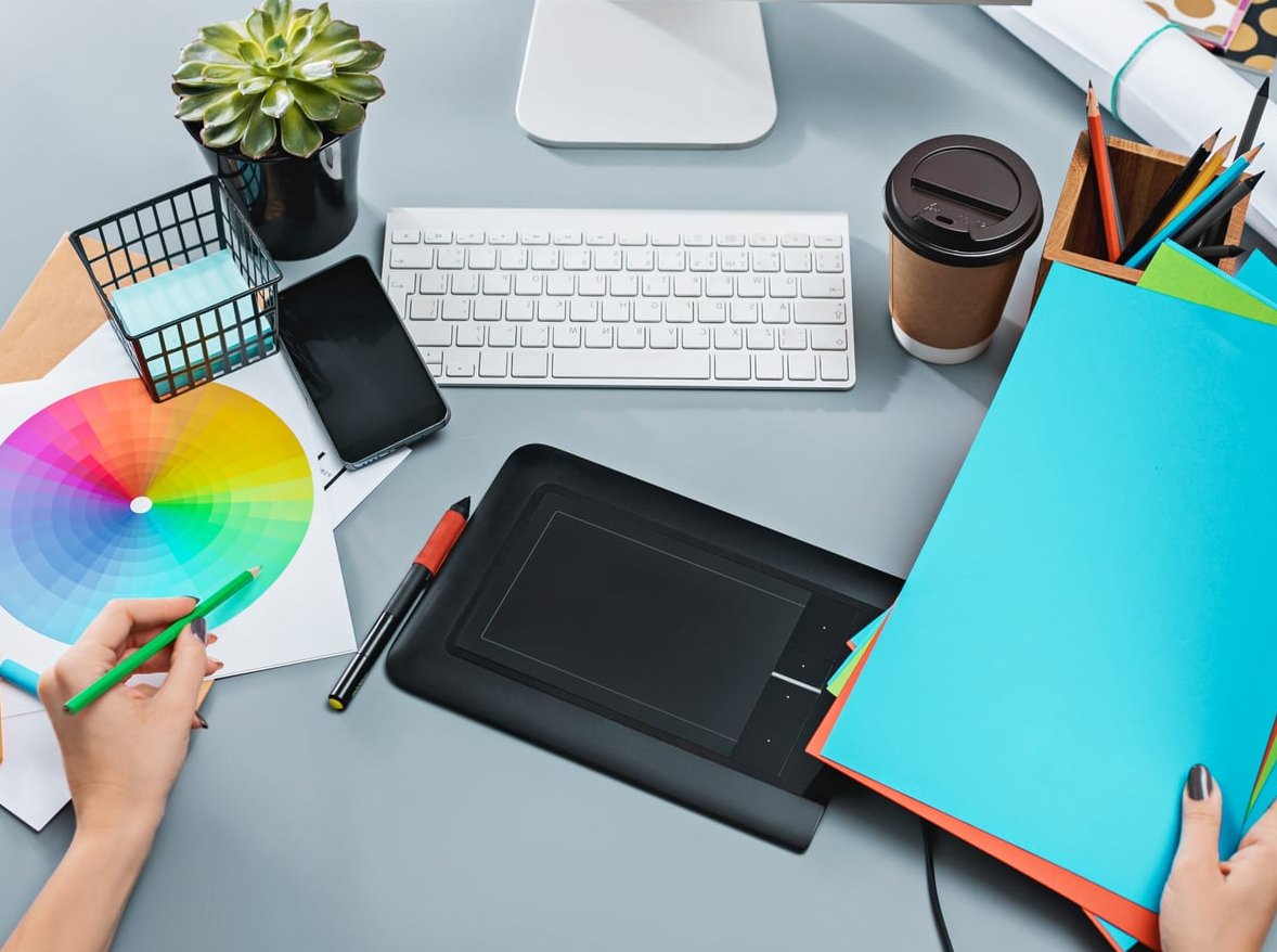designer working with computer and creative tools