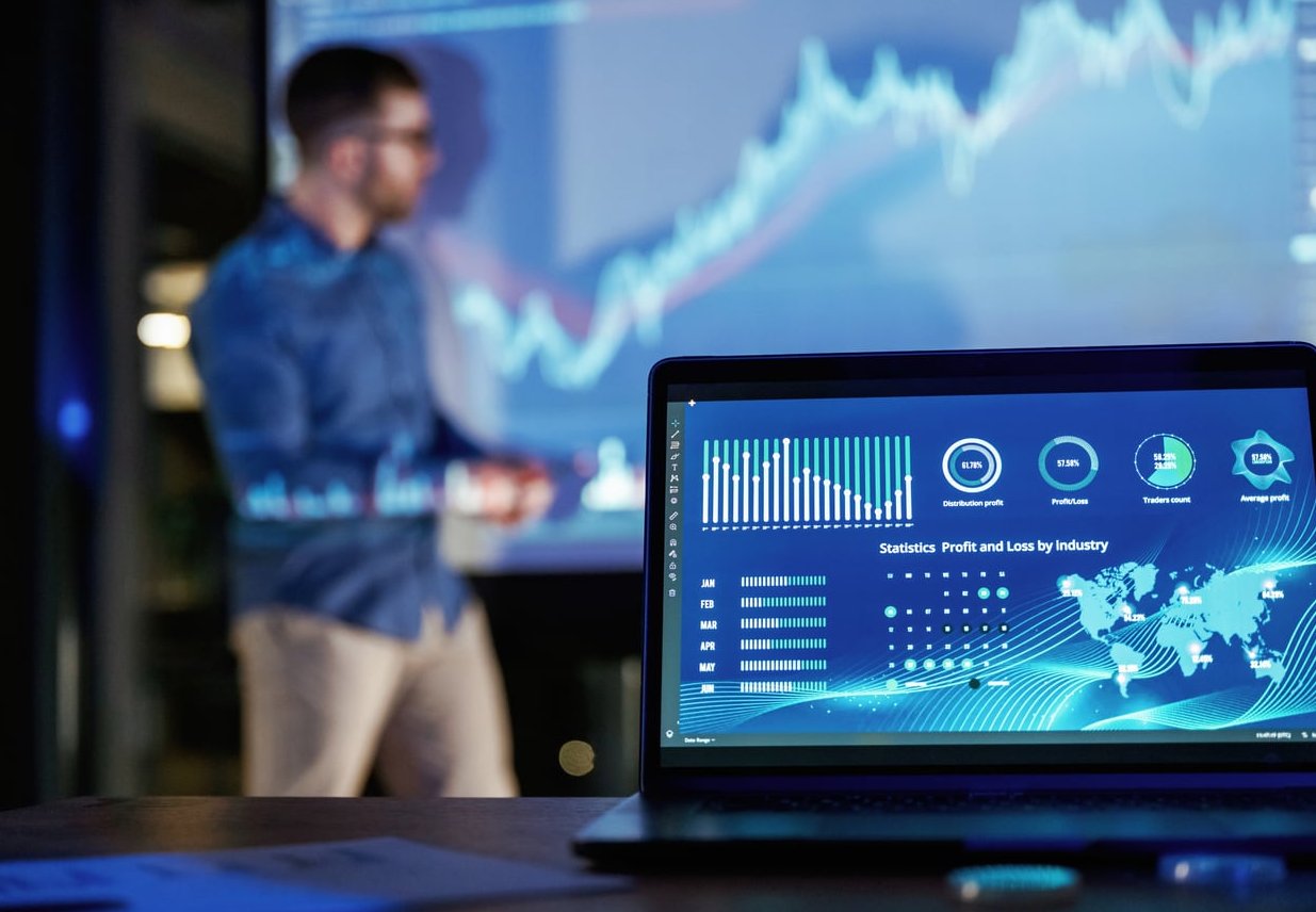 marketing team analyzing customer data laptop