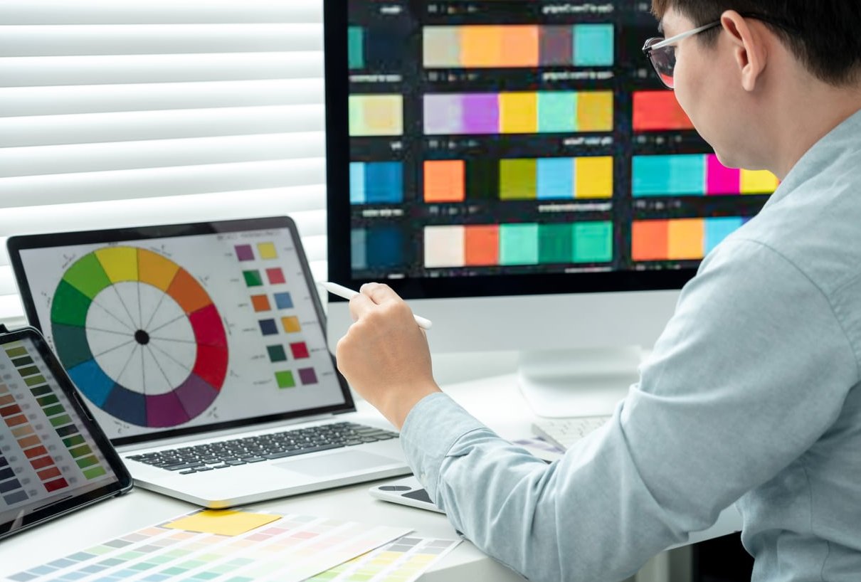designer working with computer and creative tools