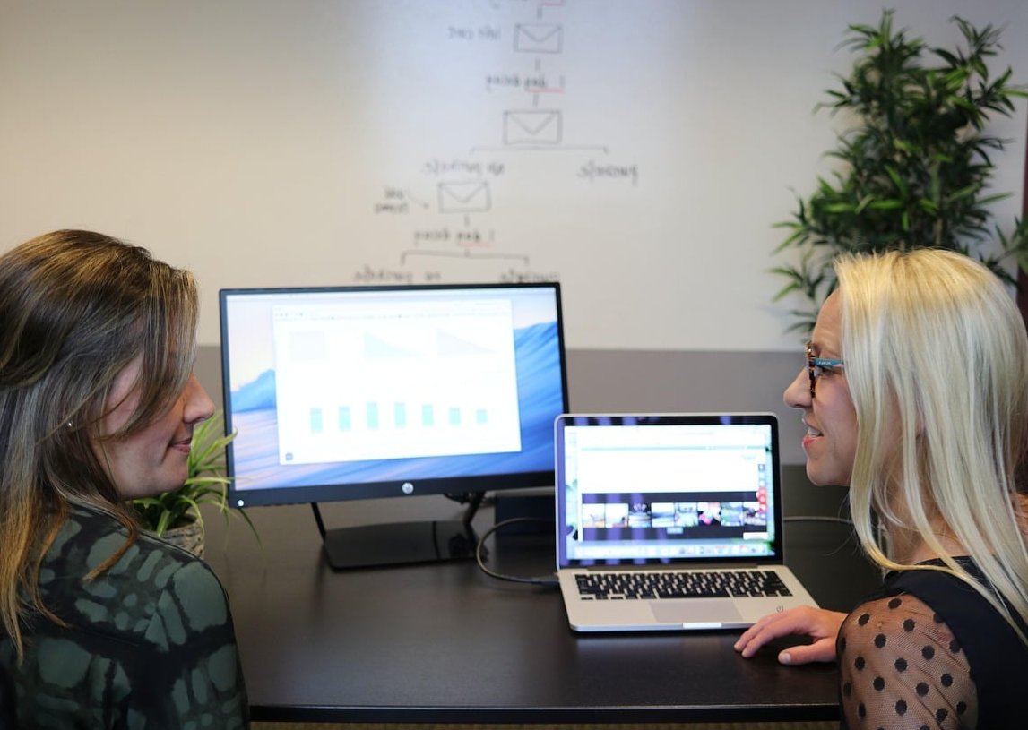 marketing team analyzing customer data laptop