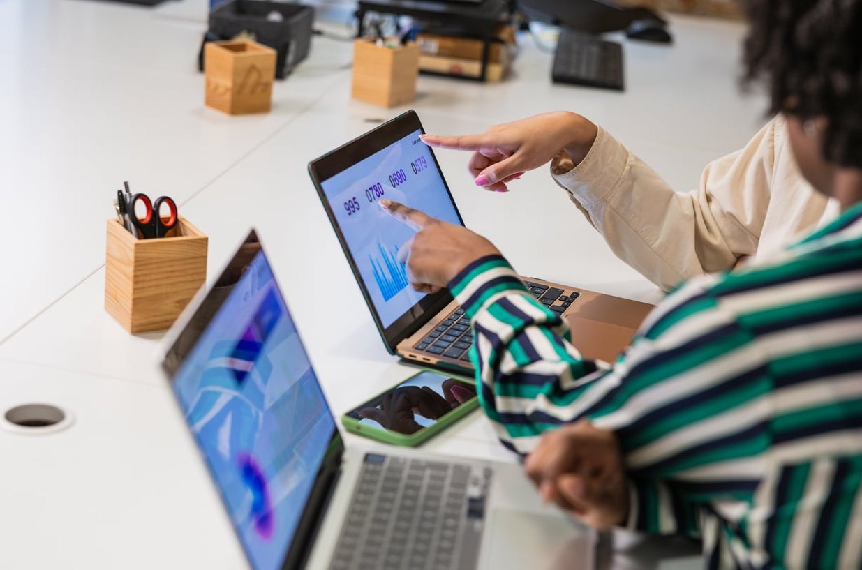 marketing team analyzing customer data laptop
