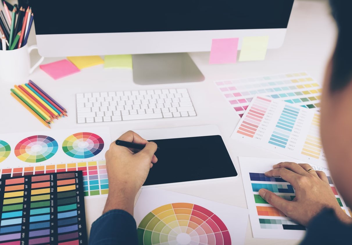 designer working with computer and creative tools