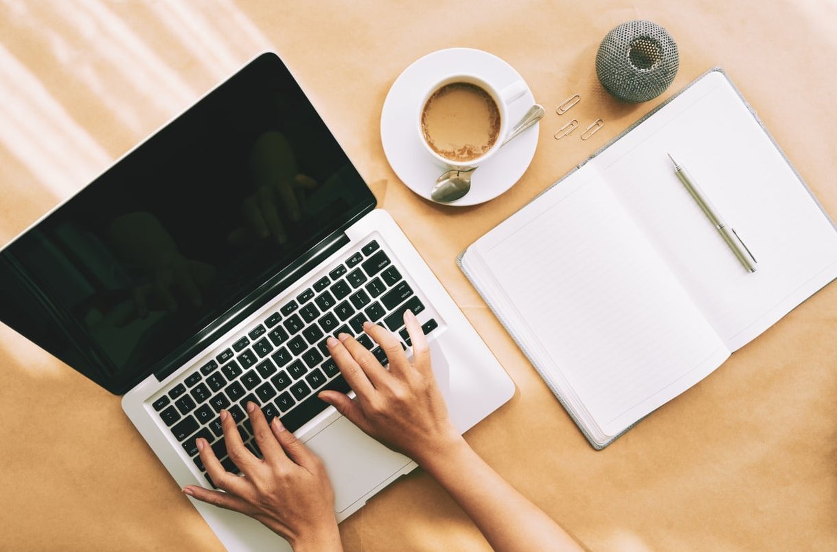copywriter writing laptop
