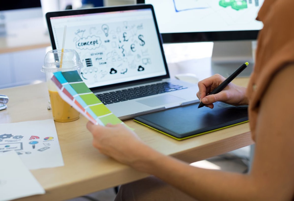 laptop graphic design workspace